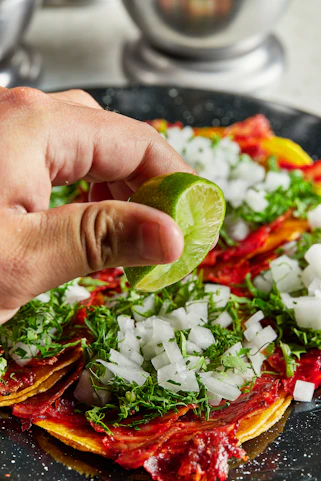 person holding green vegetable salad
