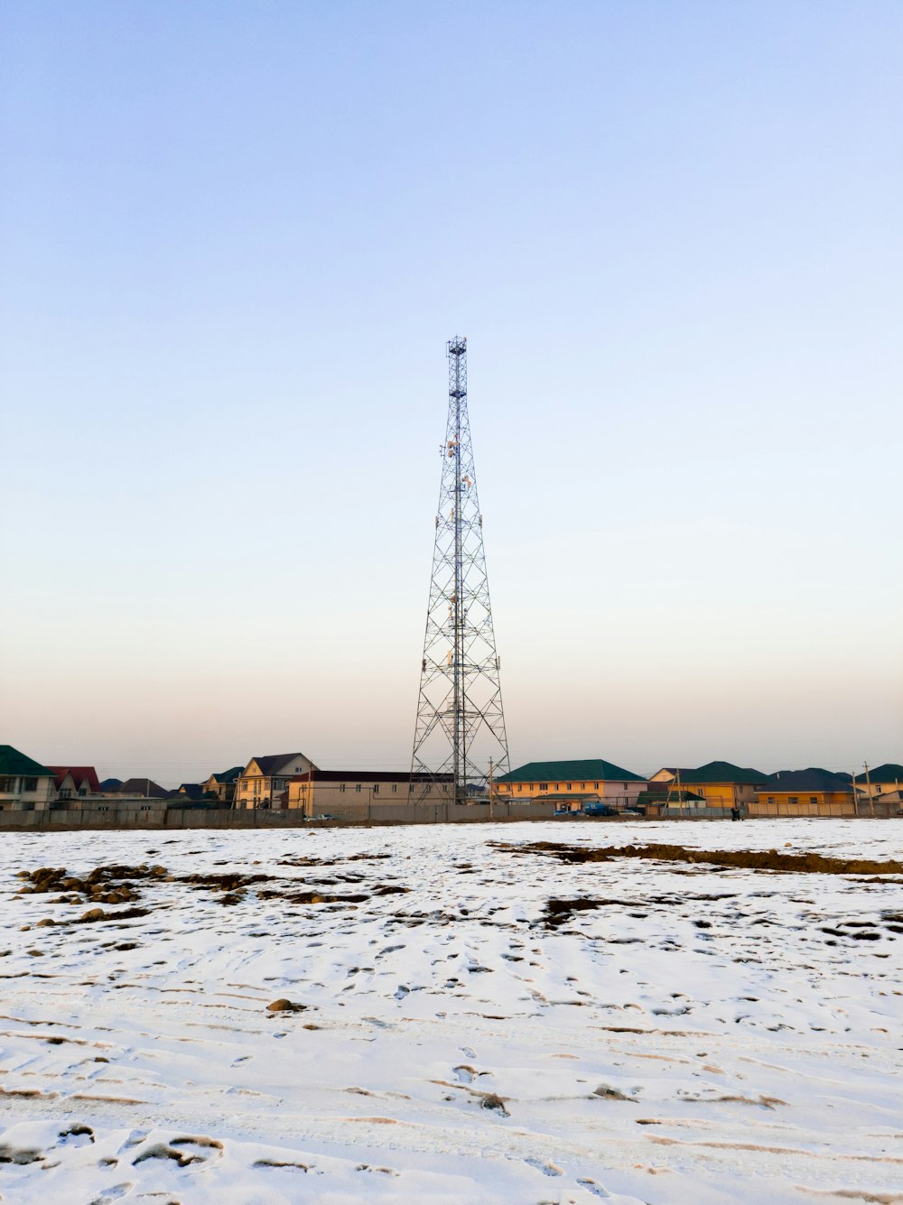 black metal tower on white sand during daytime