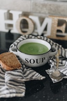 green soup in white ceramic bowl