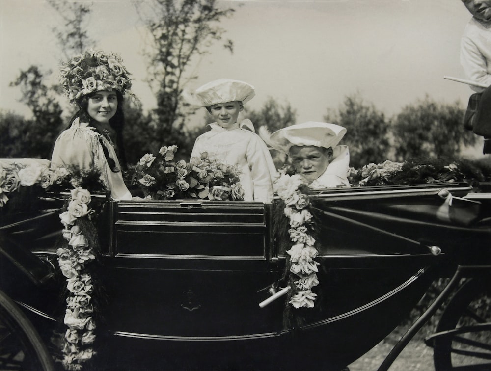 grayscale photo of man and woman on boat