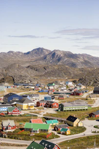 Colorful Andean village with traditional houses and mountainous backdrop.