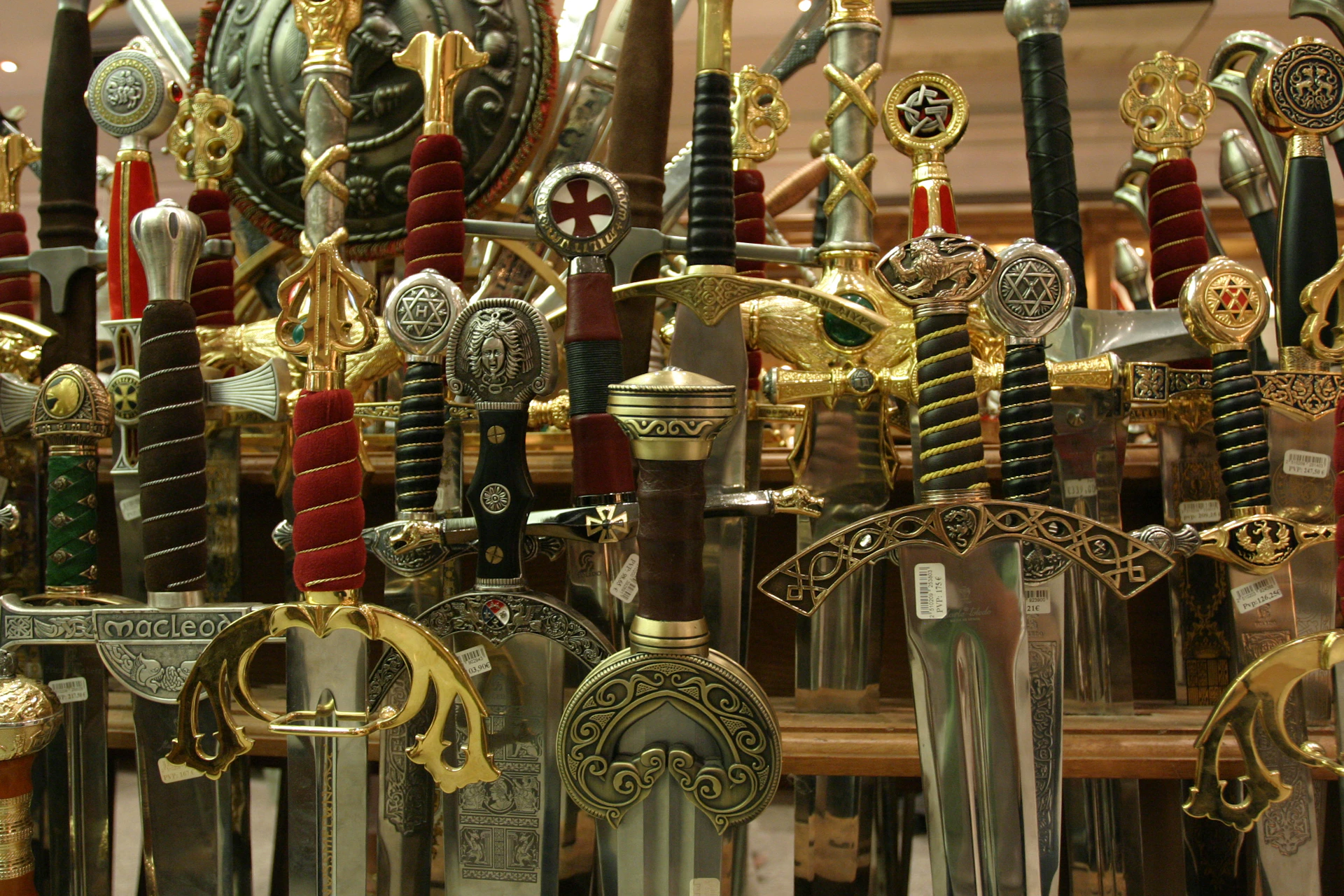 An elegant display of swords arranged artfully on a rich wooden table, capturing the premium craftsmanship and evolution through ages.
