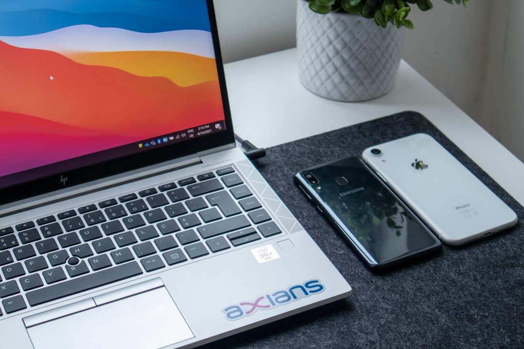 silver iphone 6 on macbook pro