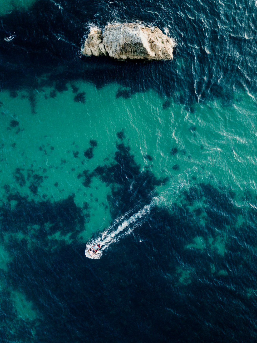 aerial view of white boat on sea during daytime