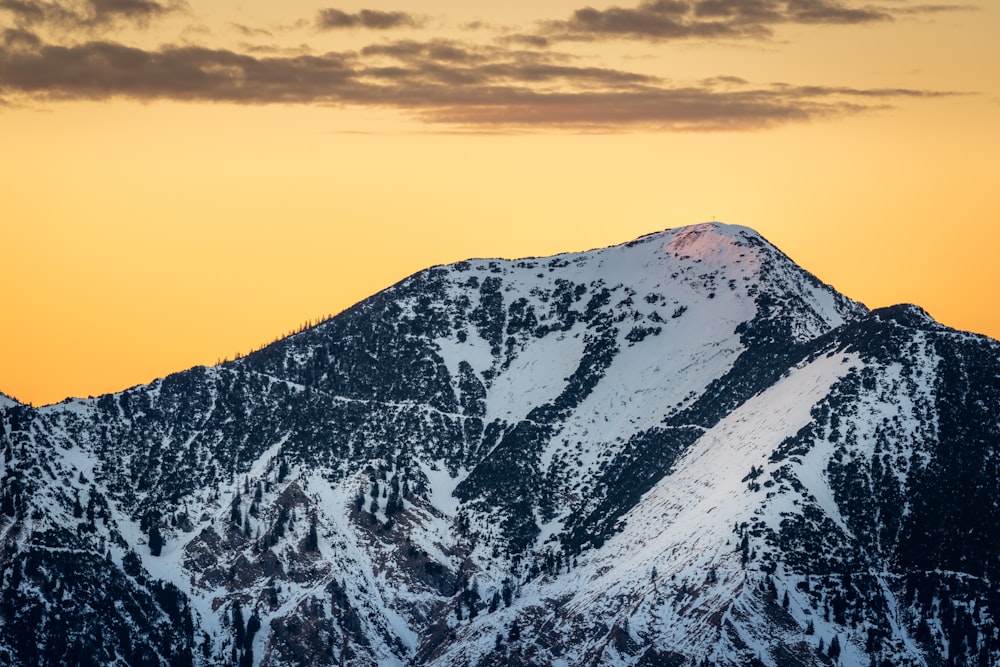 snow covered mountain during daytime