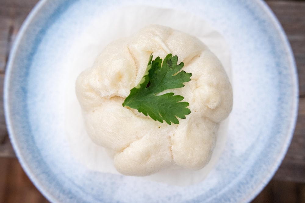 green leaf on white ceramic plate