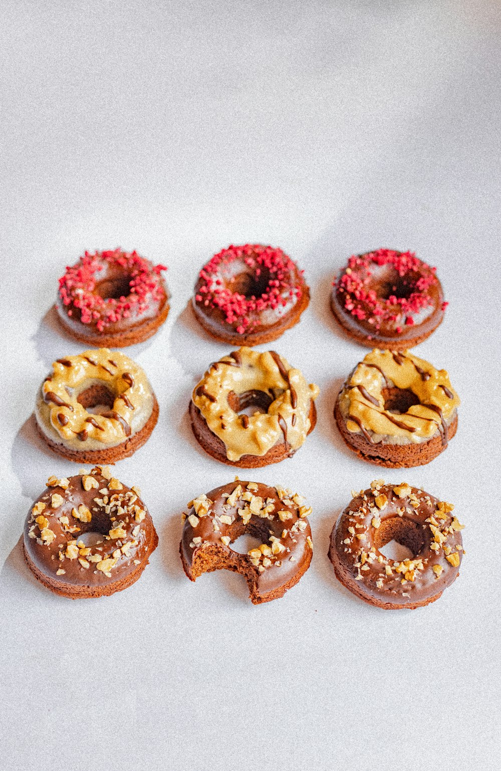 pink and brown donuts with sprinkles