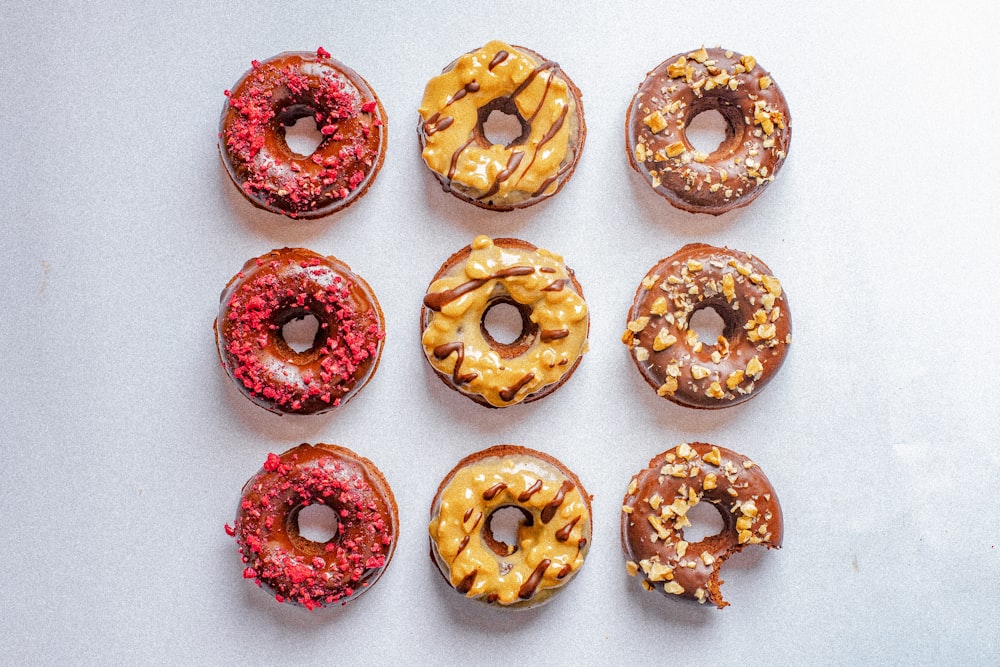 brown and white donut with sprinkles