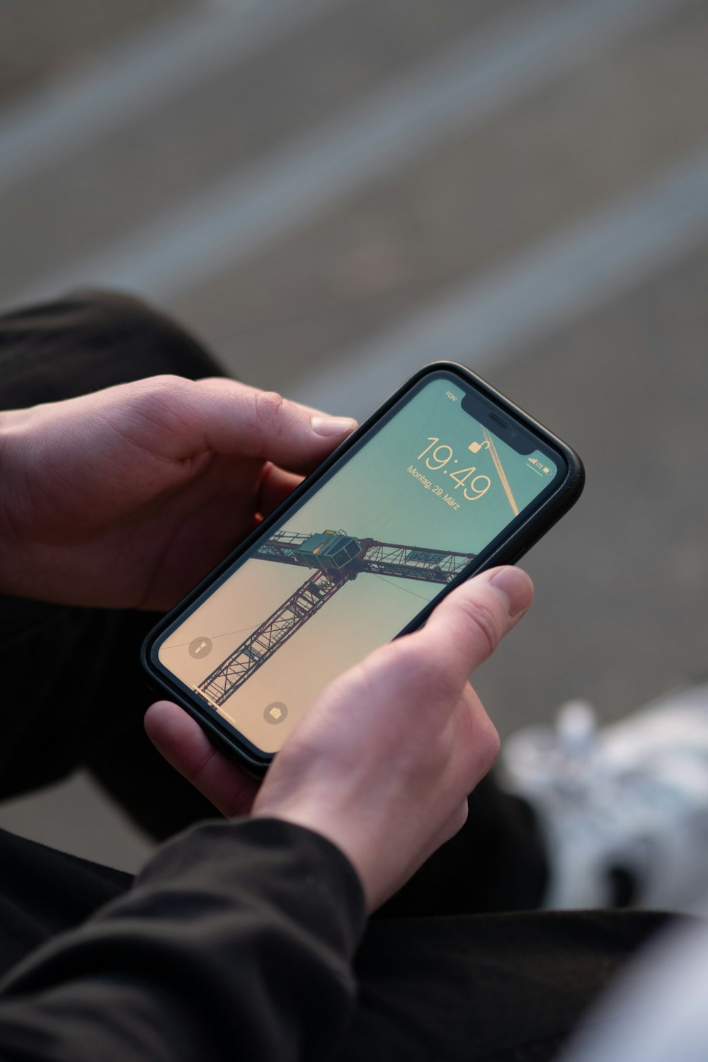 person holding black iphone 4