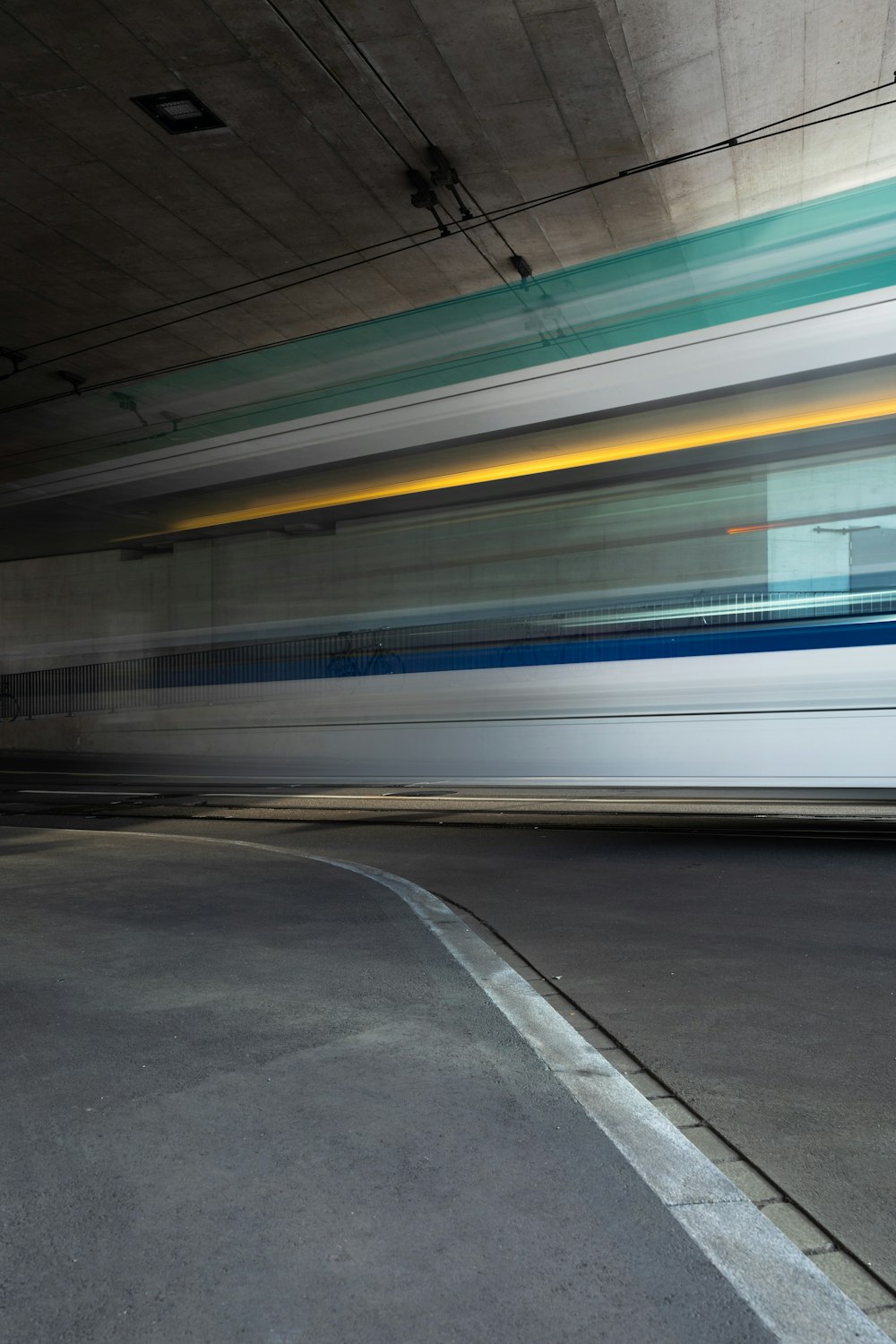 white and blue train on train station