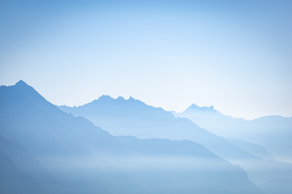 black mountains under blue sky during daytime