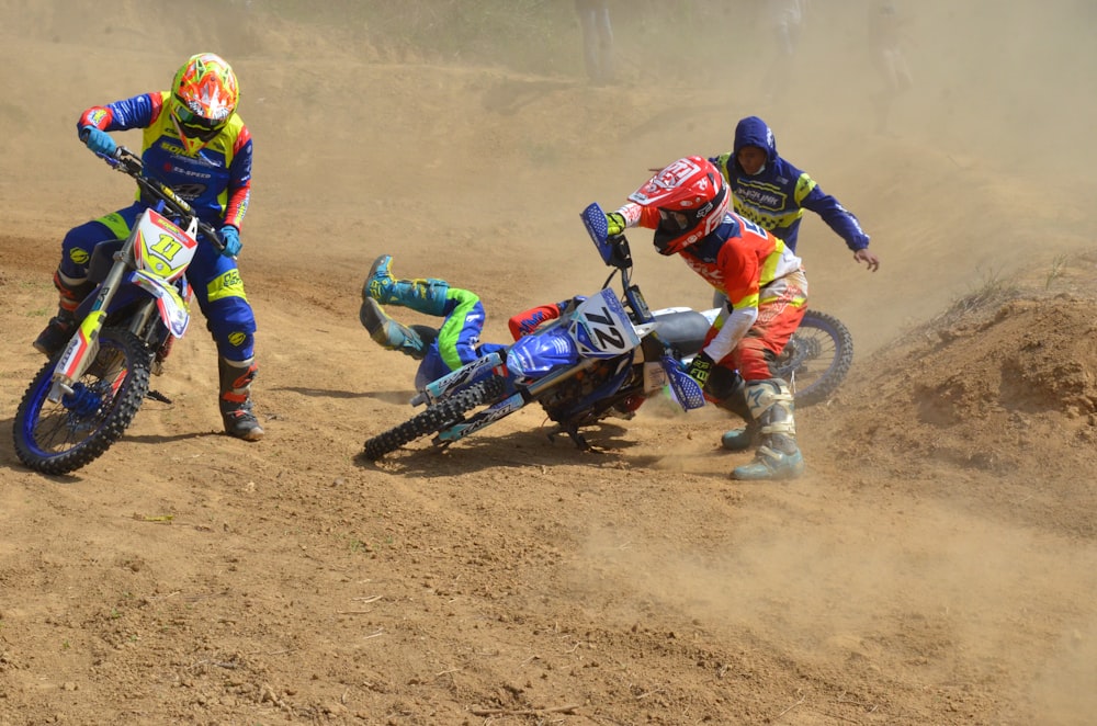 2 men riding motocross dirt bikes