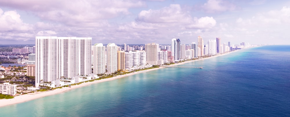 city skyline across body of water during daytime