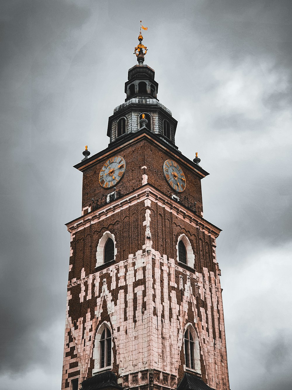 brown concrete building under gray clouds