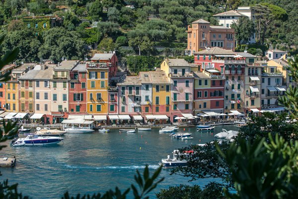 White and brown boat on body of water near buildings during daytime — Portofino, Italy
