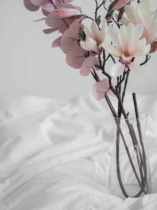 Delicate floral arrangements in neutral colors complementing the minimalist wedding decor.