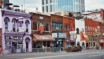A vibrant downtown neighborhood showcasing well-maintained residential and commercial properties.