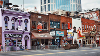 A vibrant street scene from New Orleans with colorful buildings and lively music.