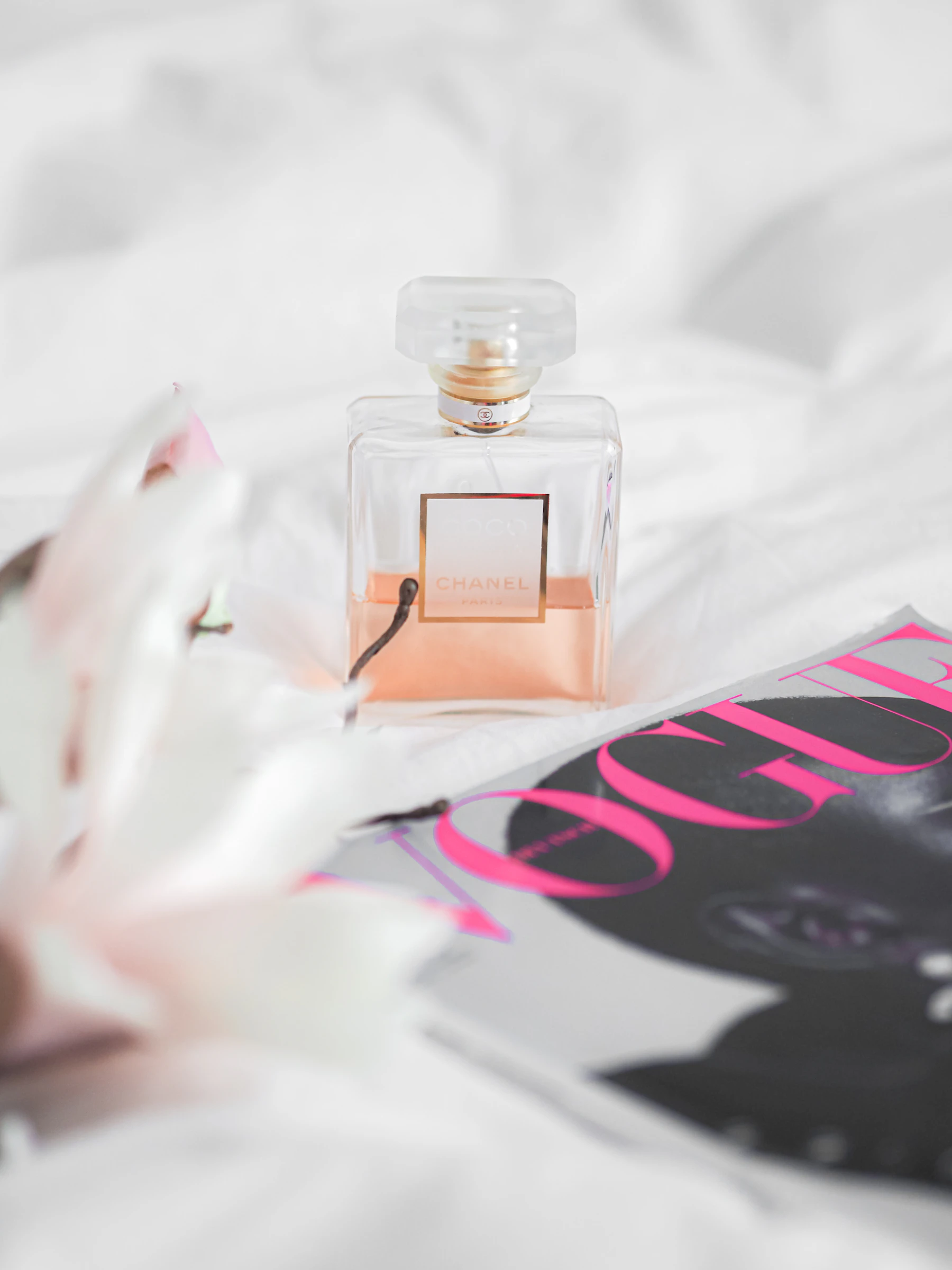 Perfume bottle styled with soft, warm lighting