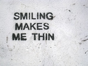 Smiling woman reflecting confidence and joy, symbolizing empowerment through female weight loss