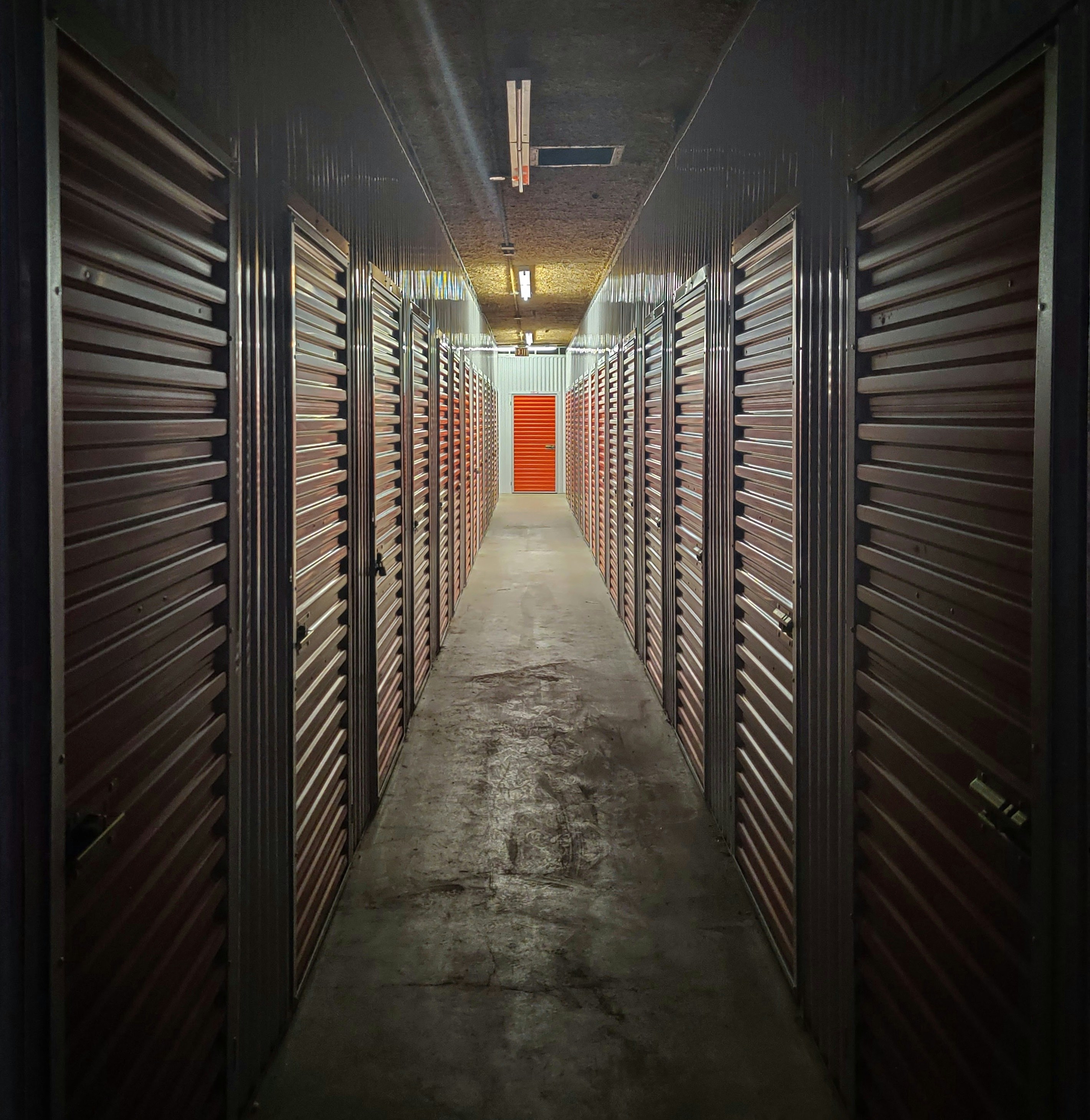empty hallway with lights turned on in the middle