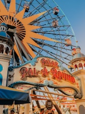 blue and brown wooden ferris wheel under blue sky during daytime