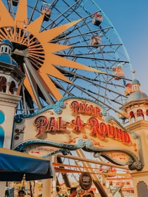 blue and brown wooden ferris wheel under blue sky during daytime