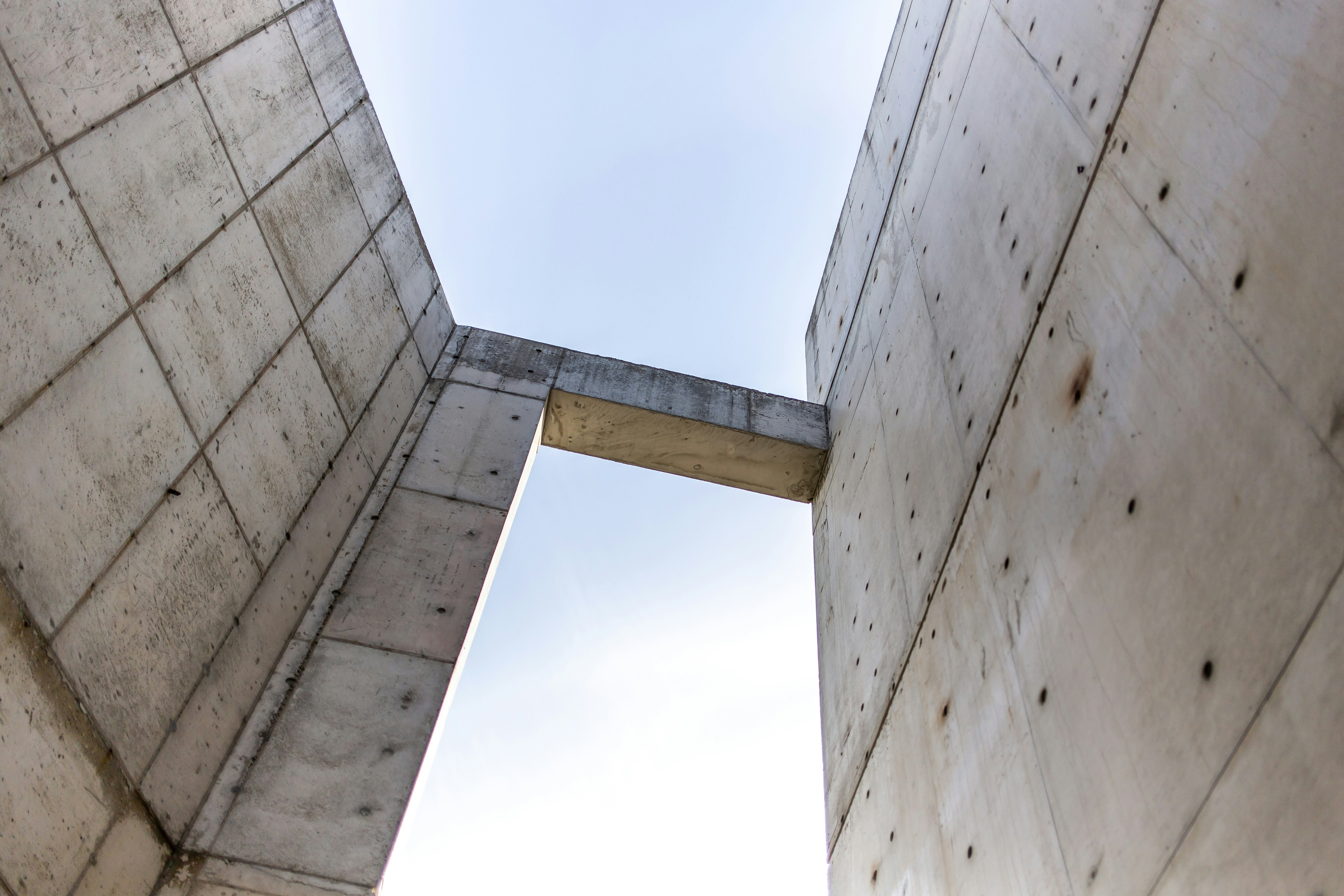 white concrete building under white sky during daytime