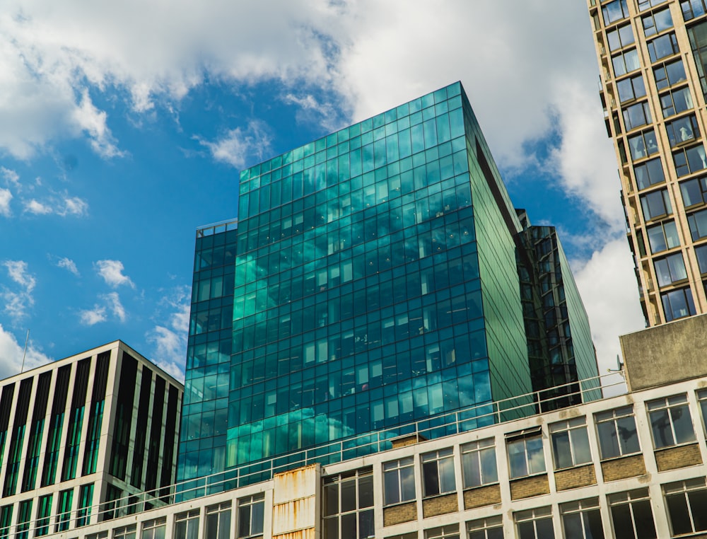 blue and white concrete building under blue sky during daytime