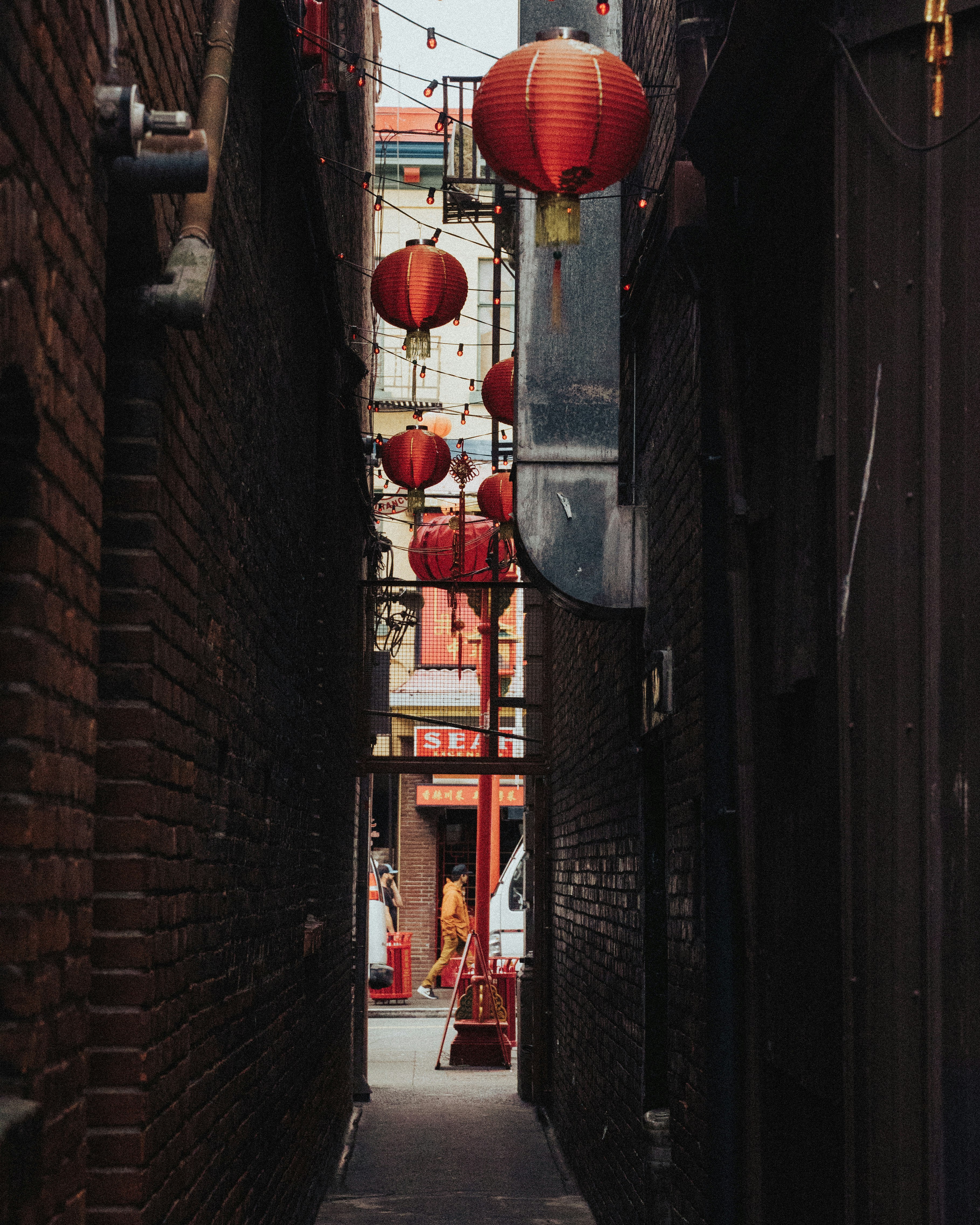 red paper lanterns on black steel fence