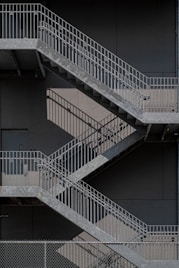 white metal staircase on gray concrete floor