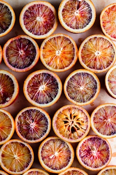 sliced orange fruit on black surface