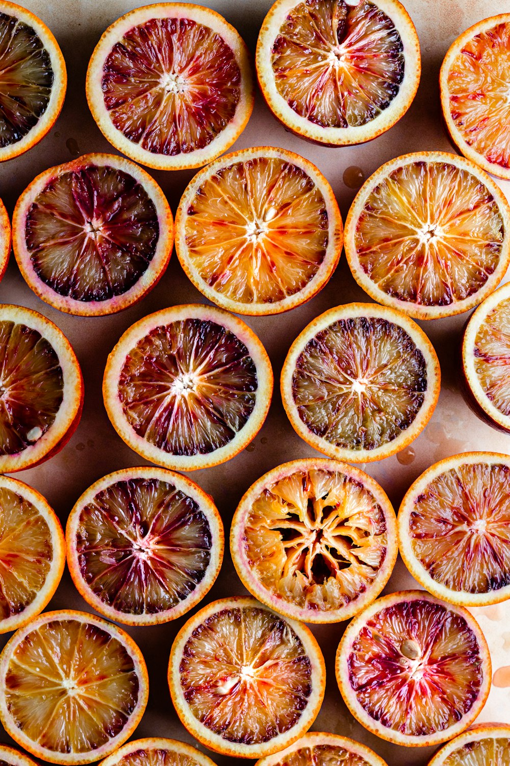 sliced orange fruit on black surface