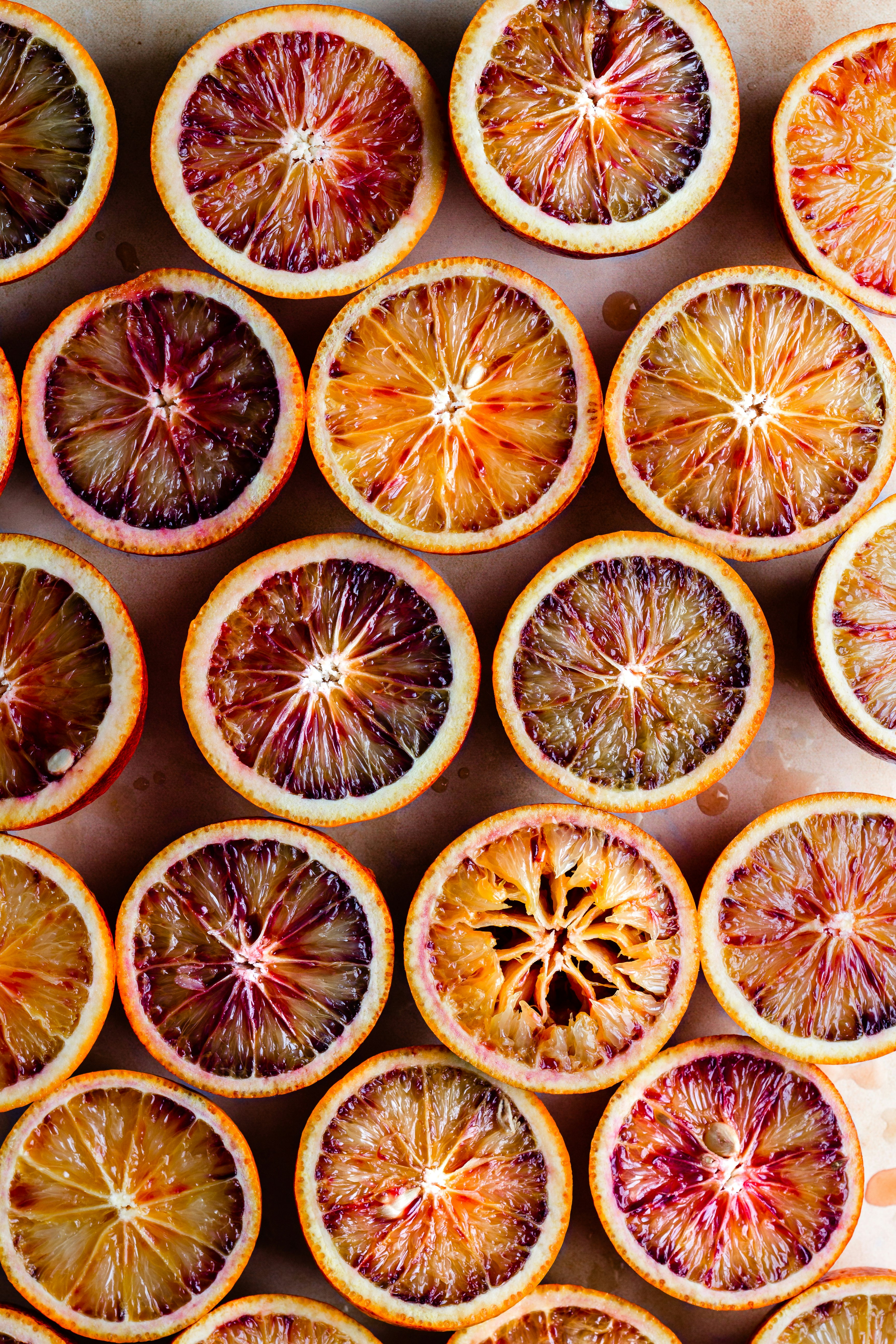 sliced orange fruit on black surface