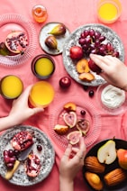 person holding yellow round fruit