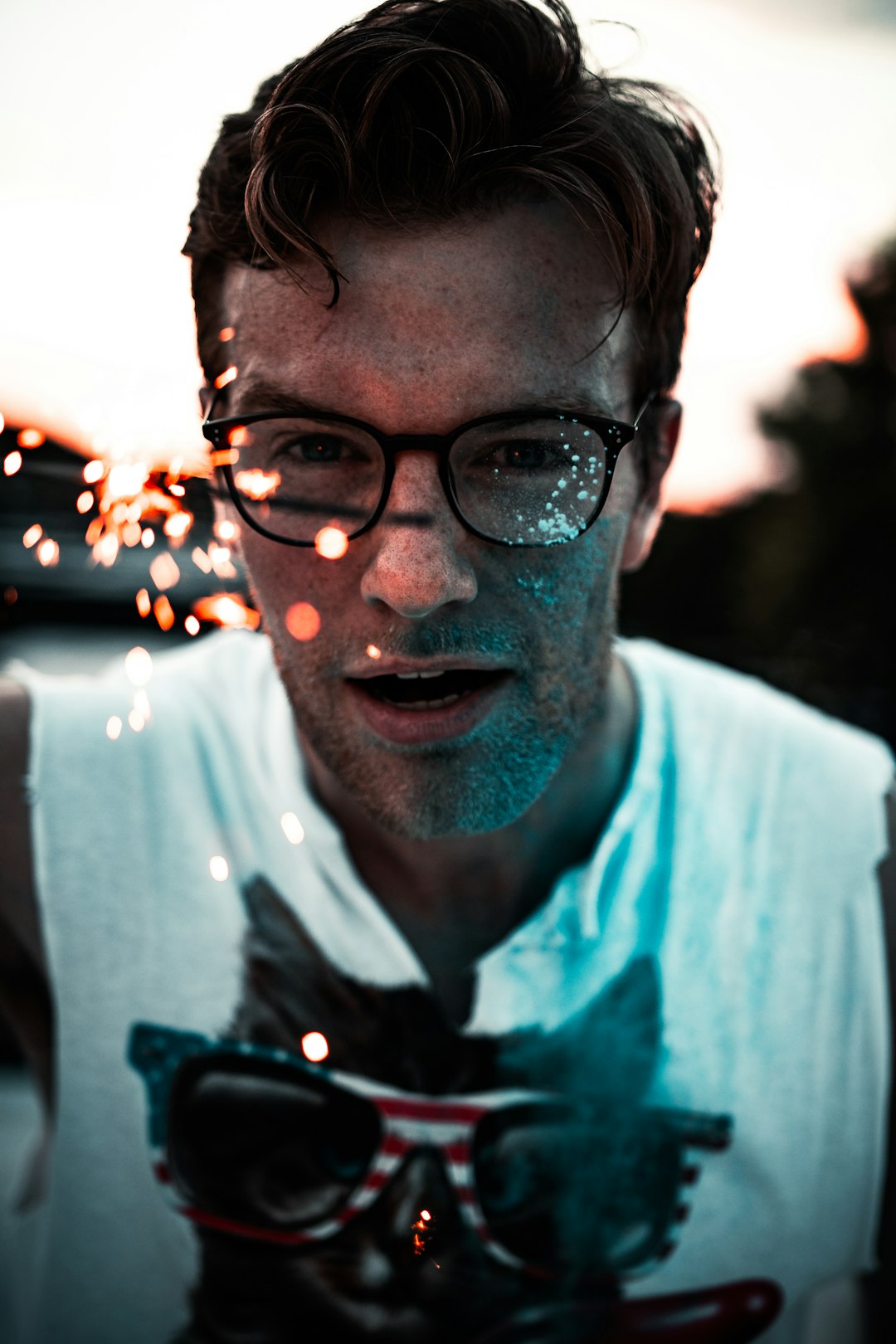 man in white crew neck shirt with black framed eyeglasses