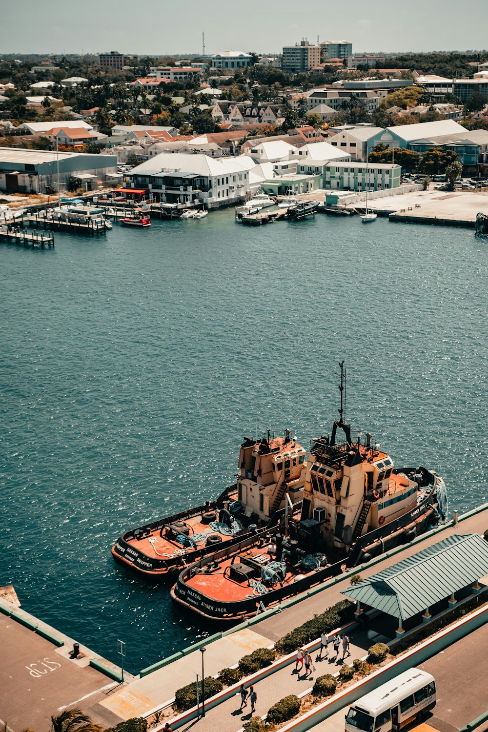 brown and white boat on body of water during daytime