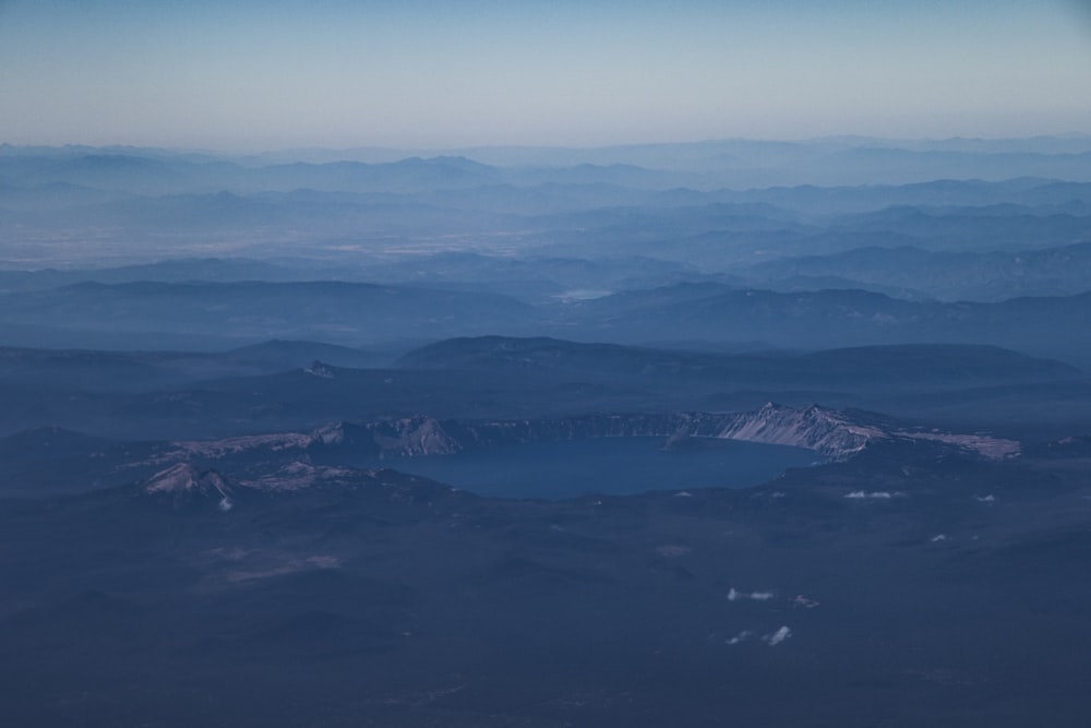 aerial view of green mountains and blue sea during daytime
