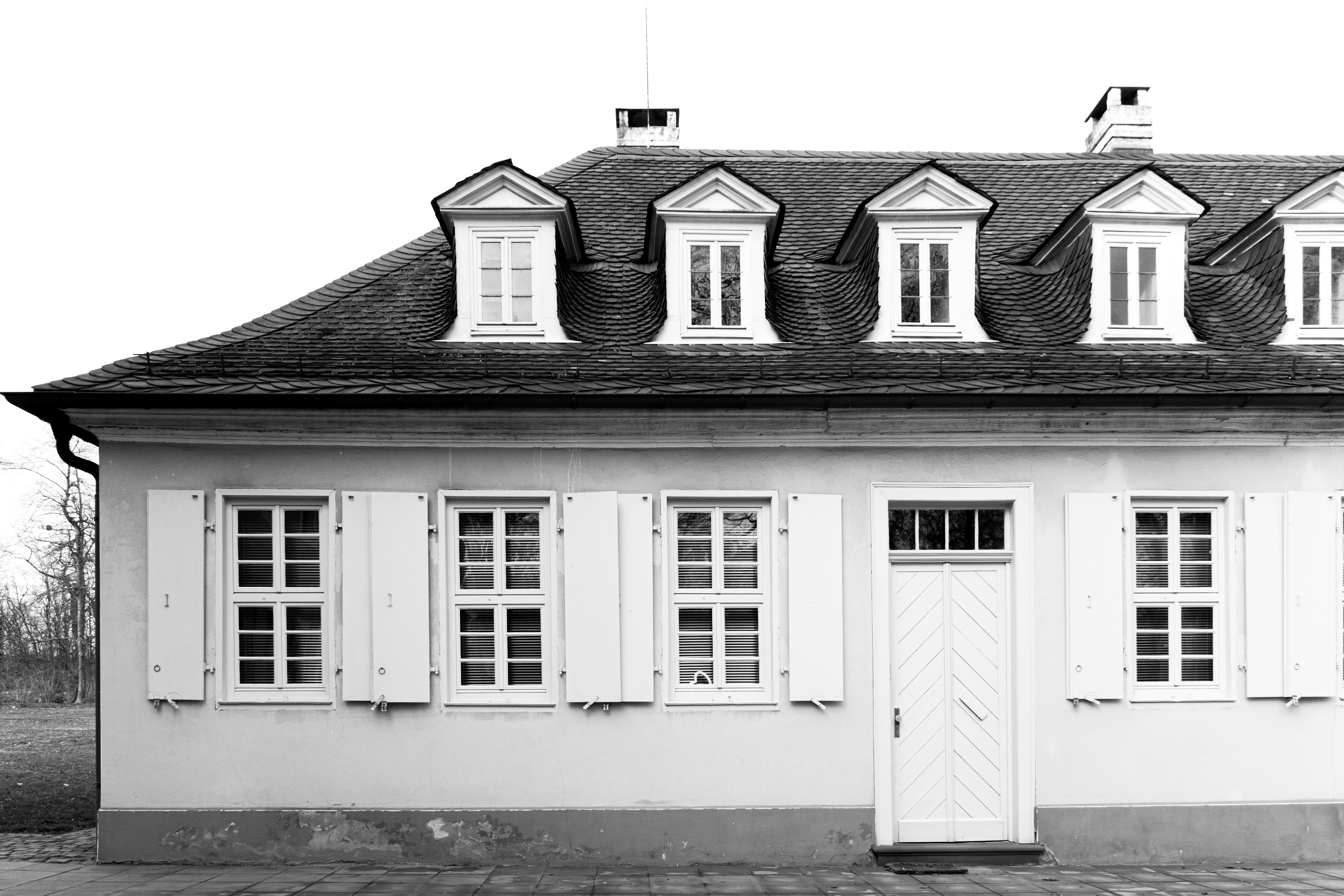 grayscale photo of 2 storey house
