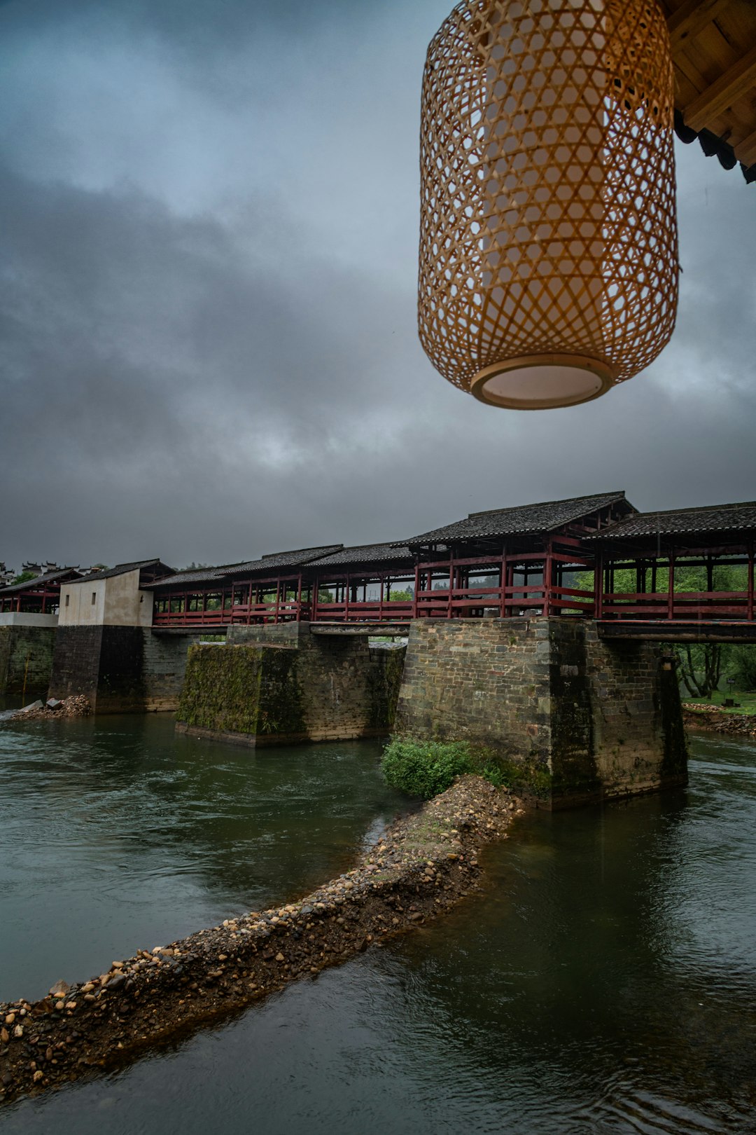 brown wicker basket on top of brown concrete bridge