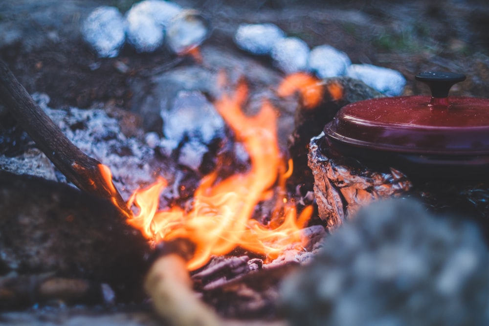 burning fire on black round container