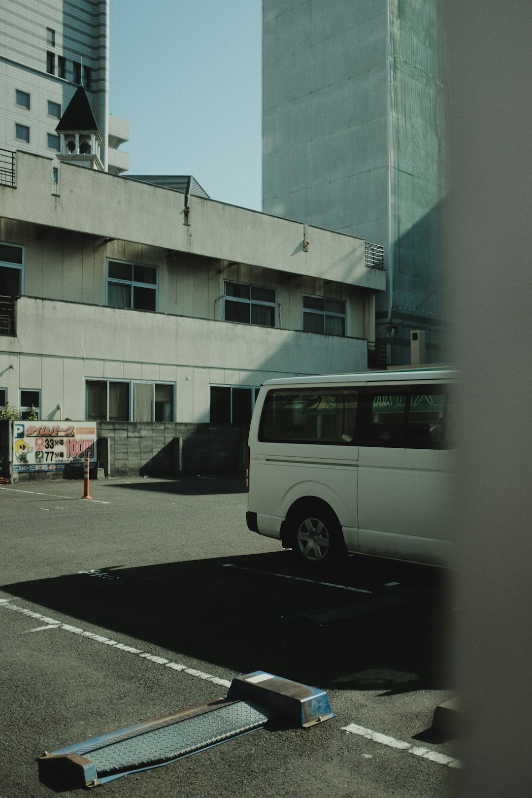 white van parked near building during daytime