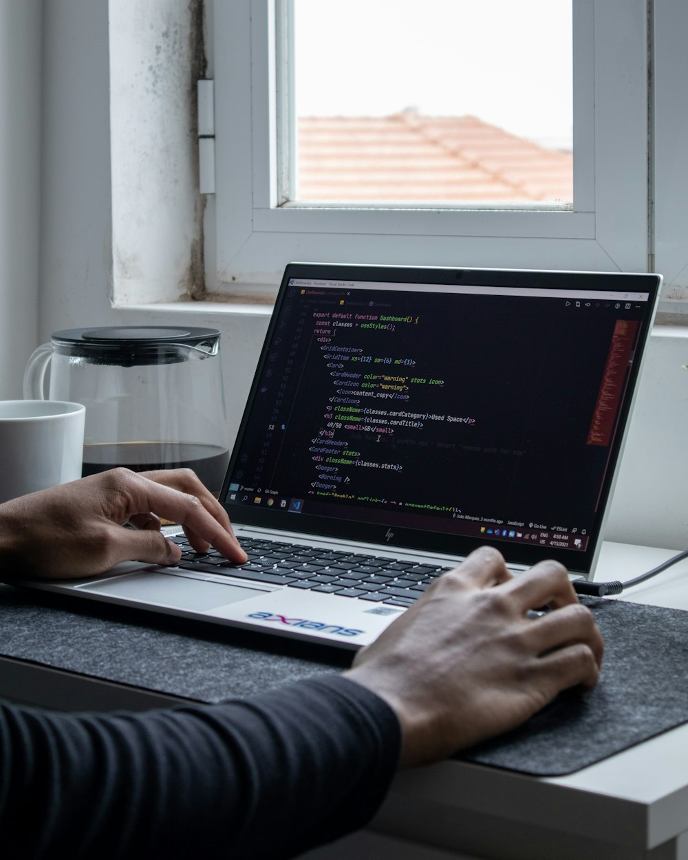 person using black laptop computer