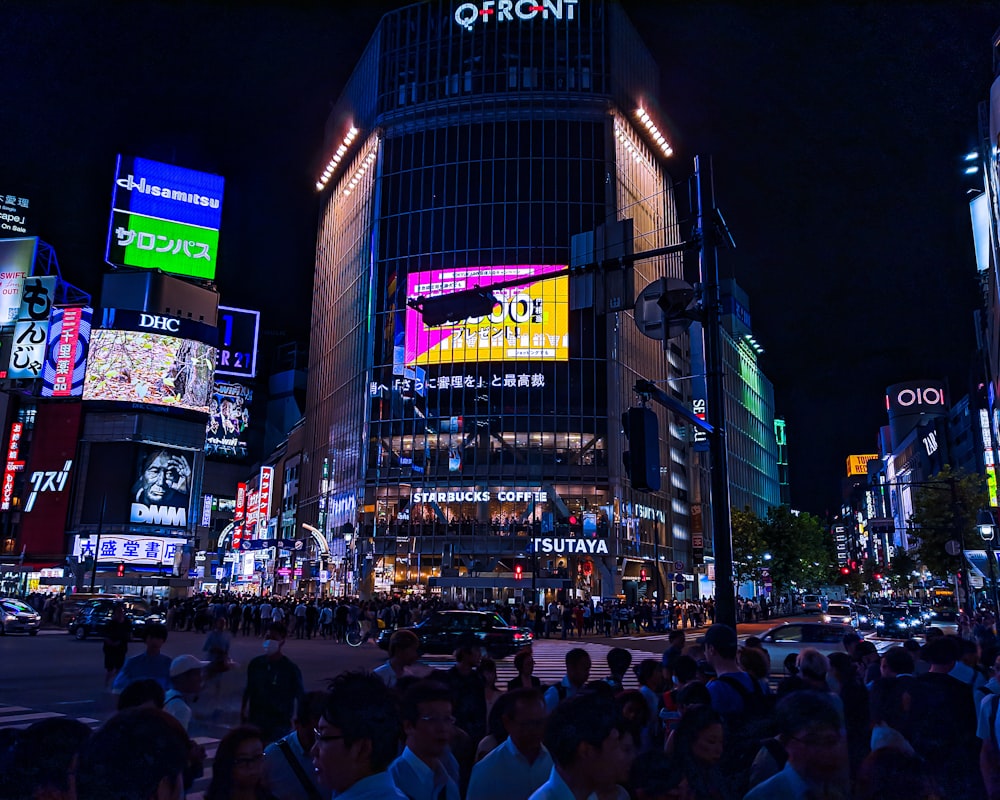 people walking on street during nighttime