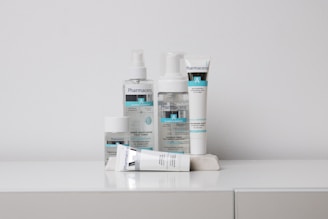 A collection of skincare products labeled 'Pharmaceris A' is arranged neatly on a white surface against a plain background. The products include bottles and tubes designed for moisturizing and sensitive skin care.
