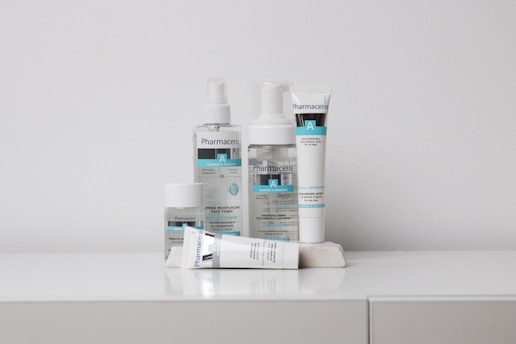 A collection of skincare products labeled 'Pharmaceris A' is arranged neatly on a white surface against a plain background. The products include bottles and tubes designed for moisturizing and sensitive skin care.