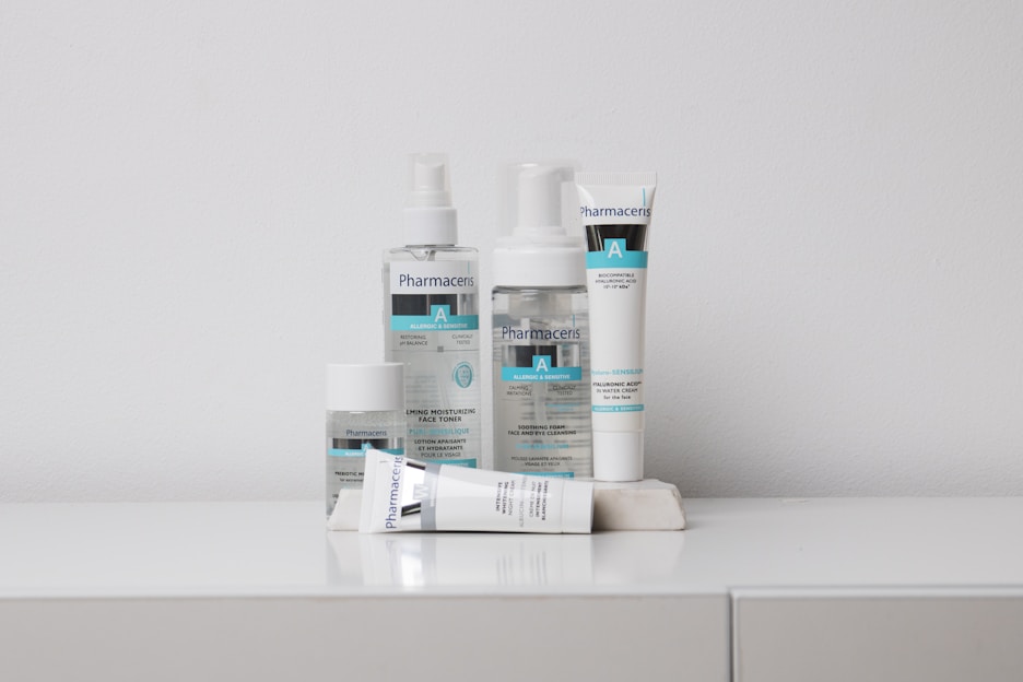 A collection of skincare products labeled 'Pharmaceris A' is arranged neatly on a white surface against a plain background. The products include bottles and tubes designed for moisturizing and sensitive skin care.