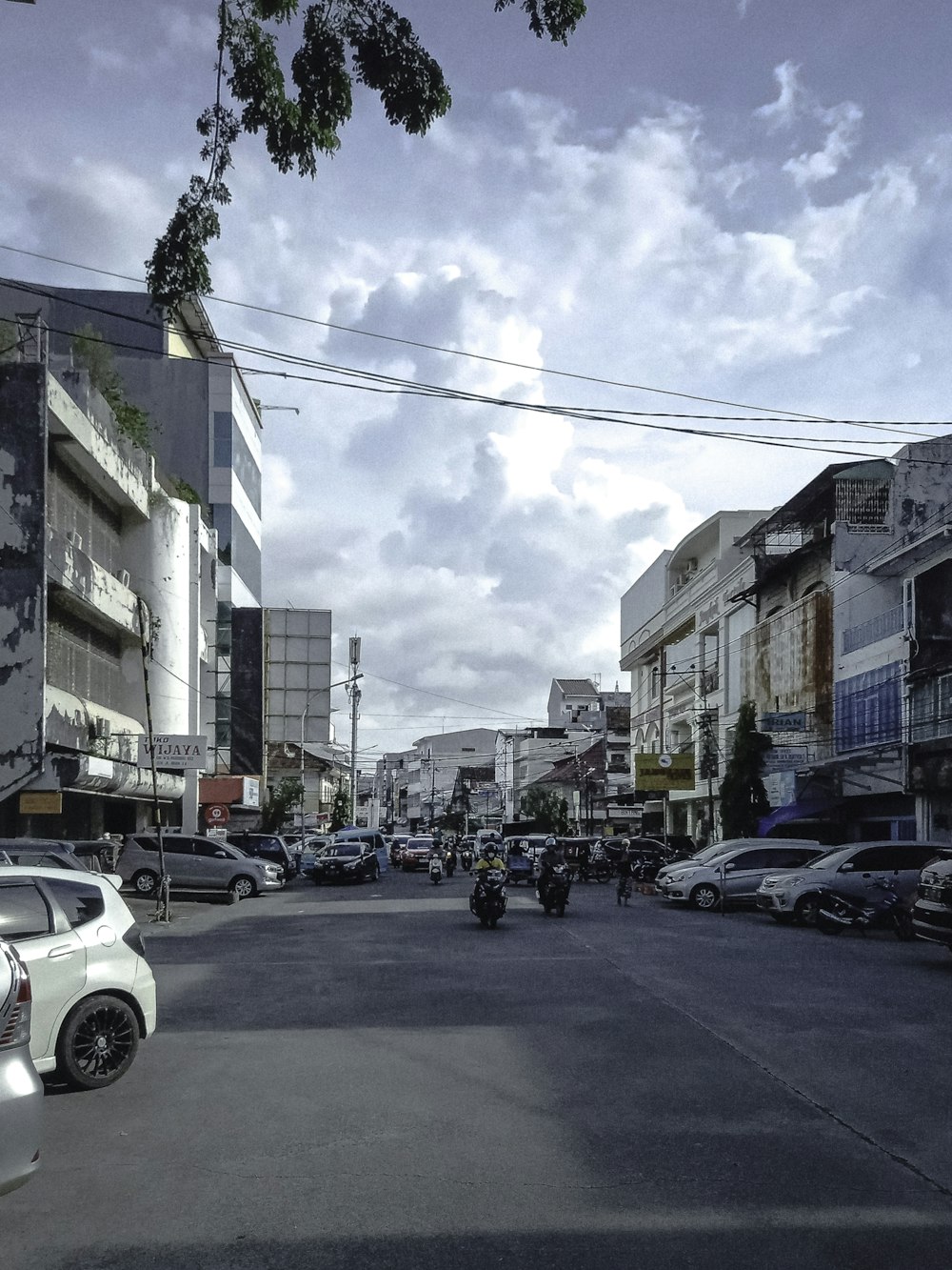 cars parked on side of the road during daytime