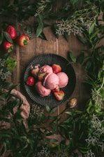 red round fruit on black round plate