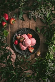 red round fruit on black round plate
